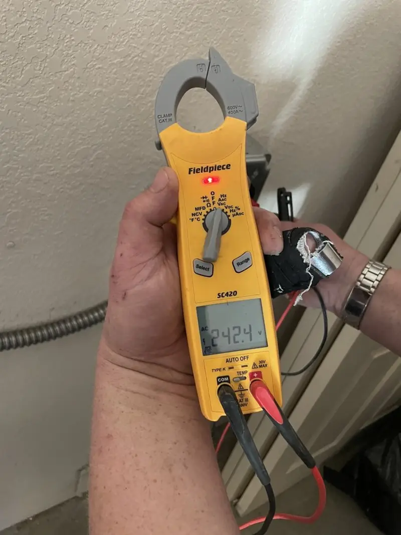 Voltage testing with clamp meter during Outlet Installation in Upper Gwynedd